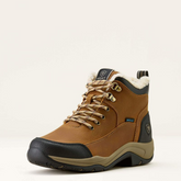 Brown hiking boot with black sole on a white background